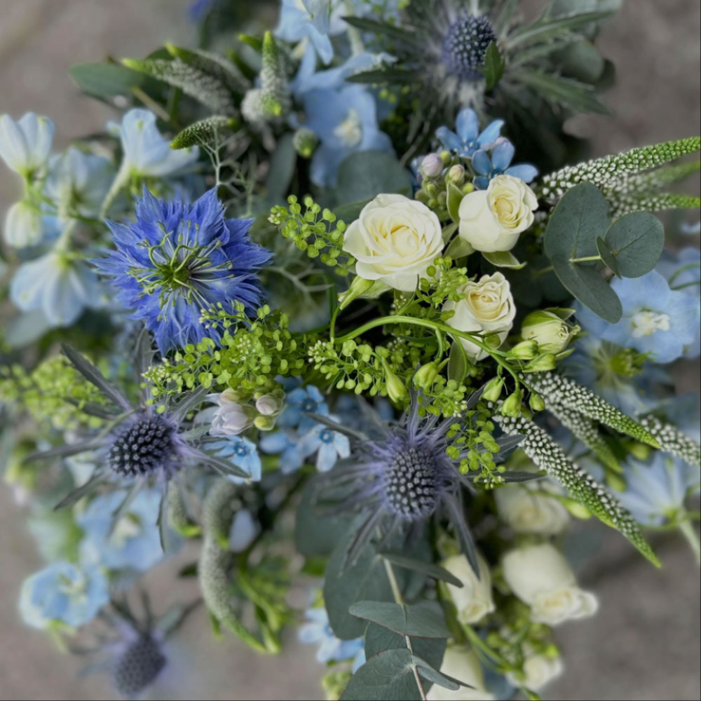 Blue and white wedding flower arrangement