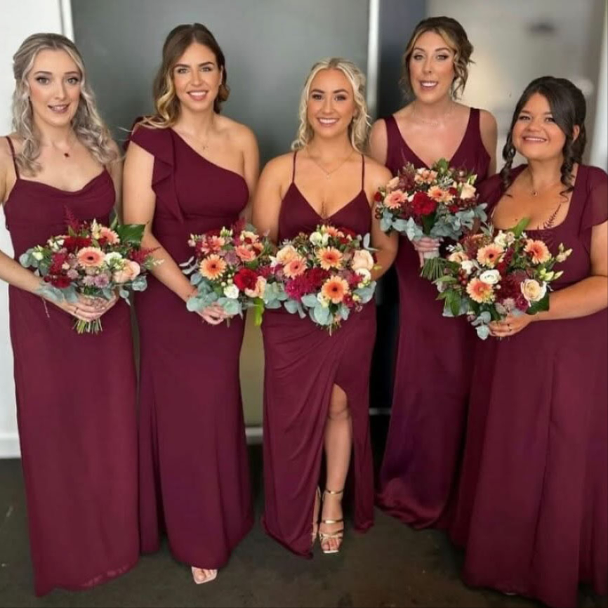 Bride and bridesmaids holding wedding bouquets in Oldham