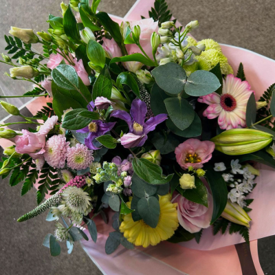 Pastel Meadow Bouquet - A soft hand-tied bouquet in pastel shades, beautifully arranged with seasonal flowers and fresh foliage.