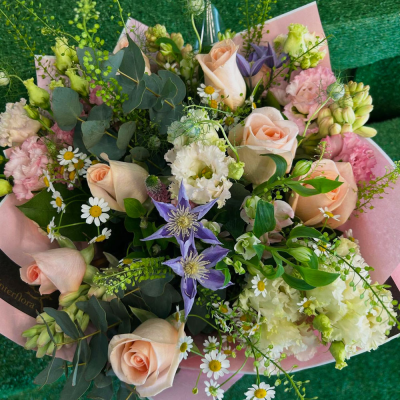 Country Garden Bouquet - A natural-style bouquet of delicate seasonal blooms in soft pastel tones, expertly hand-tied.
