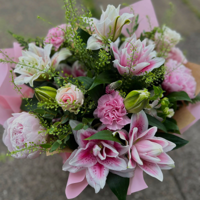 Pink Lily Delight - A stunning hand-tied bouquet featuring elegant pink lilies and complementary seasonal blooms.