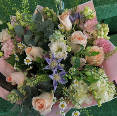 Blushing Meadow - Soft, romantic, and full of natural charm, the Blushing Meadow Bouquet is a graceful arrangement in delicate blush, ivory, lavender, and fresh green tones. Expertly hand-tied with a beautiful mix of seasonal blooms, airy foliage, and textured accents, it creates a garden-inspired design that feels effortlessly elegant. Wrapped in premium presentation, this bouquet is perfect for birthdays, anniversaries, thank you gifts, new baby celebrations, or simply letting someone know you're thinking of them. Each bouquet is handcrafted by our florists using the freshest seasonal flowers, making every arrangement beautifully unique.